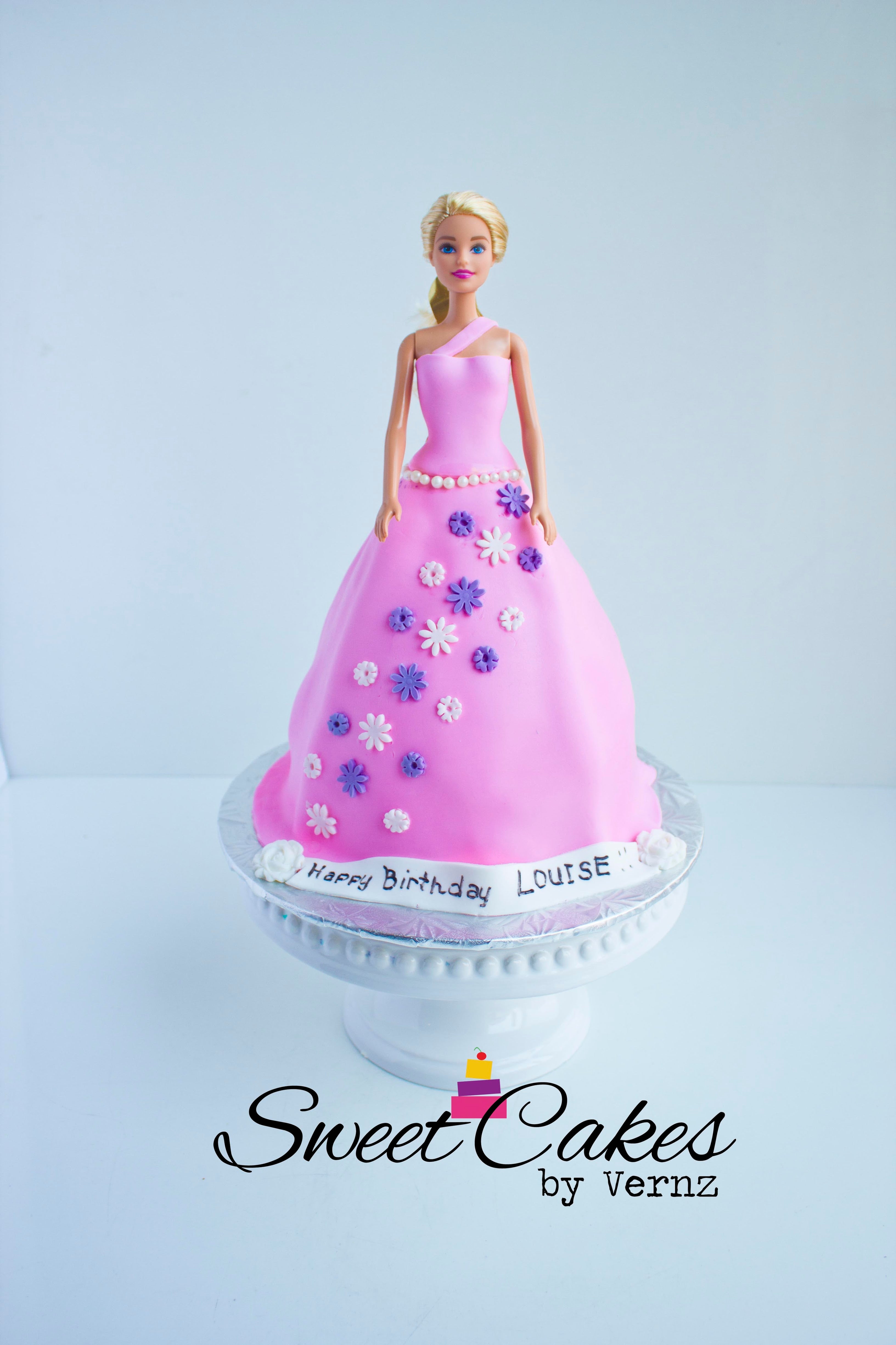 This is an amazing birthday cake that we have in our special cakes collection. Our cakes are locally made in Calgary. If your daughter is looking for a themed Barbie Doll cake, this is it! Order today!